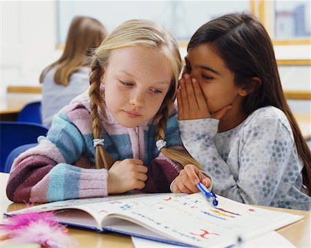 pictures of a little girl whispering - Students Whispering in Classroom Stock Photo - Rights-Managed, Code: 700-00523399