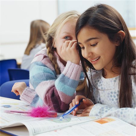 pictures of a little girl whispering - Students Whispering in Classroom Stock Photo - Rights-Managed, Code: 700-00523401