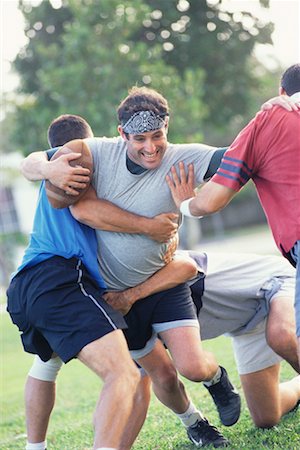 friends playing american football - Friends Playing Football Stock Photo - Rights-Managed, Code: 700-00523697