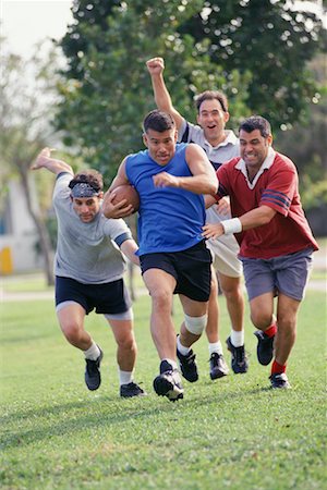 friends playing american football - Men Playing Football Stock Photo - Rights-Managed, Code: 700-00523699