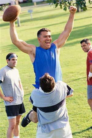 friends playing american football - Men Playing Football Stock Photo - Rights-Managed, Code: 700-00523714