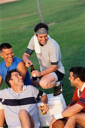 pictures man opening bottle - Men Drinking Beer after Football Stock Photo - Rights-Managed, Code: 700-00523731