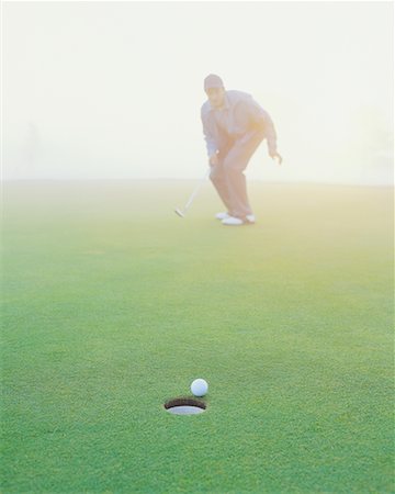 simsearch:6113-07159316,k - Golfer on Putting Green Stock Photo - Rights-Managed, Code: 700-00523806