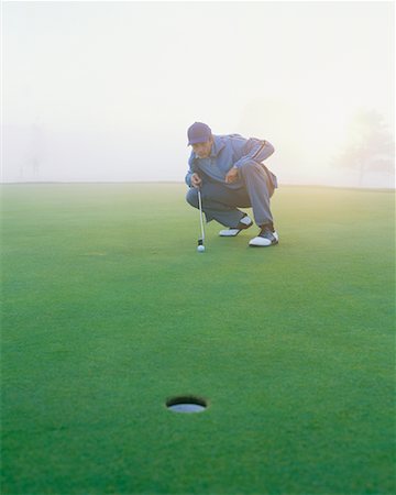 simsearch:6113-07159316,k - Golfer on Putting Green Stock Photo - Rights-Managed, Code: 700-00523809