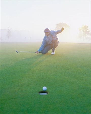 simsearch:6113-07159316,k - Golfer on Putting Green Stock Photo - Rights-Managed, Code: 700-00523810