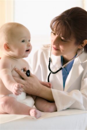 pediatrician latin hispanic - Doctor Examining Baby Stock Photo - Rights-Managed, Code: 700-00523886