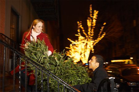 Couple Taking Christmas Tree Home Stock Photo - Rights-Managed, Code: 700-00523942