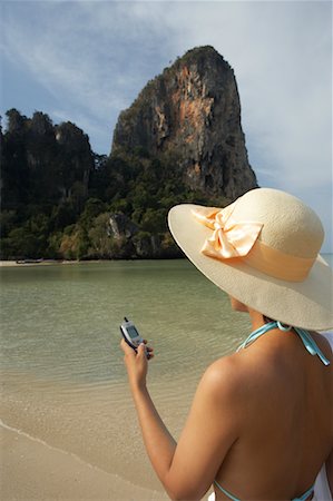 simsearch:700-00530261,k - Woman in Hat Dialing Cellphone, Railay Beach, Krabi, Thailand Stock Photo - Rights-Managed, Code: 700-00530263