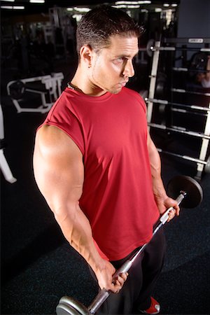 simsearch:400-05268701,k - Man Lifting Barbell In Gym Foto de stock - Con derechos protegidos, Código: 700-00530578