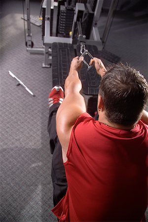 simsearch:689-03131217,k - Man Using Weight Machine In Gym Stock Photo - Rights-Managed, Code: 700-00530570