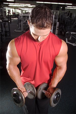 simsearch:689-03131217,k - Man Using Dumb-bells In Gym Stock Photo - Rights-Managed, Code: 700-00530587