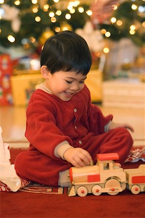 simsearch:700-00547217,k - Boy Playing with Toy Train on Christmas Morning Stock Photo - Rights-Managed, Code: 700-00544360