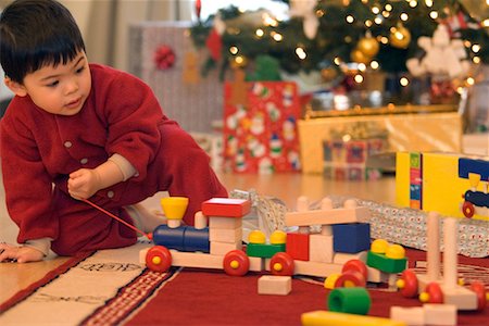 simsearch:700-00280017,k - Boy Playing with Toy Train on Christmas Morning Stock Photo - Rights-Managed, Code: 700-00544363