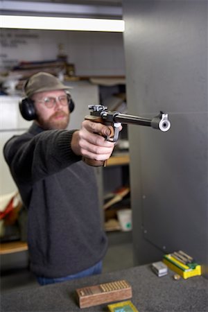 simsearch:700-00546343,k - Man Shooting Handgun in Firing Booth Stock Photo - Rights-Managed, Code: 700-00546341