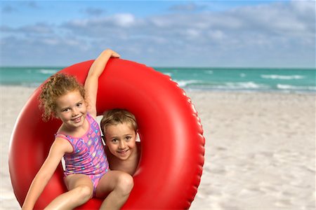 simsearch:700-00083447,k - Boy and Girl with Inner Tube on Beach Stock Photo - Rights-Managed, Code: 700-00546442