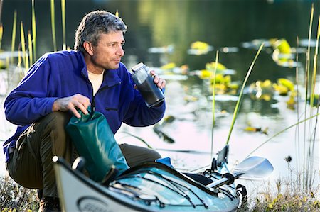 simsearch:400-05308802,k - Man Drinking From Thermos on Kayak Trip Stock Photo - Rights-Managed, Code: 700-00546659