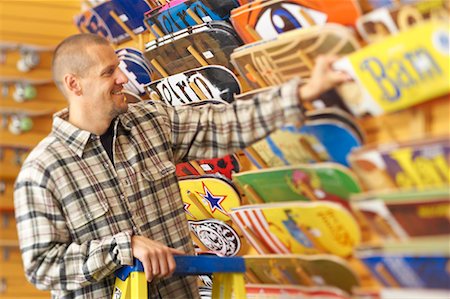 simsearch:700-06407782,k - Man Looking at Skateboards in Store Stock Photo - Rights-Managed, Code: 700-00546733