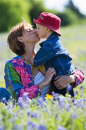 Mother Kissing Son Outdoors Stock Photo - Rights-Managed, Code: 700-00547047