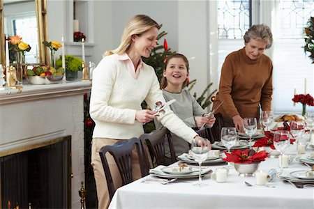 simsearch:700-00047619,k - Grandmother, Mother and Daughter Setting Table for Christmas Dinner Stock Photo - Rights-Managed, Code: 700-00547134