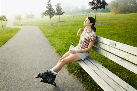 Woman Resting on Park Bench Stock Photo - Rights-Managed, Code: 700-00549460