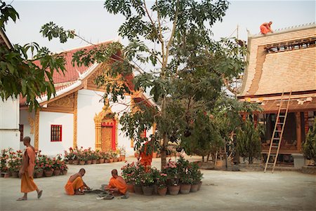 simsearch:700-00049076,k - Buddhist Monks Repairing Roof and Building Sim Of Wat Choum Khong, Luang Prabang, Laos Stock Photo - Rights-Managed, Code: 700-00549490