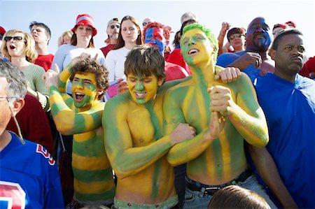 simsearch:700-02418130,k - Fans Cheering for Opposing Team, Standing in the Middle of a Crowd Stock Photo - Rights-Managed, Code: 700-00549853