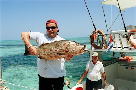 Portrait of Man Holding Fish Camaguey, Cuba Stock Photo - Rights-Managed, Code: 700-00543730