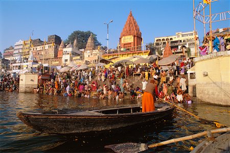 people bathing ganges india - Boat on River with Crowd on Riverbank, Uttar Pradesh, Varanasi, India Stock Photo - Rights-Managed, Code: 700-00554560