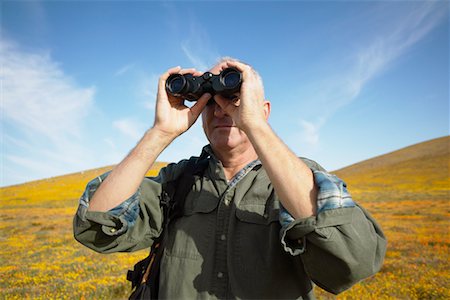 simsearch:700-00554641,k - Man Looking Through Binoculars Stock Photo - Rights-Managed, Code: 700-00554620