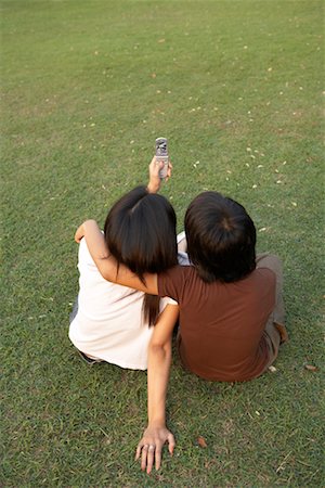 Couple Taking Photo with Cellular Phone Stock Photo - Rights-Managed, Code: 700-00555125