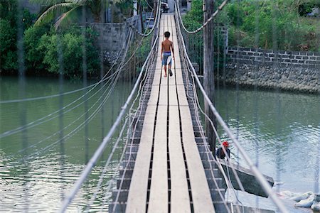 simsearch:700-00555259,k - Boy Crossing Footbridge, Ilocos Sur, Philippines Stock Photo - Rights-Managed, Code: 700-00555283