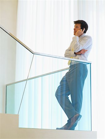 side view railings glass - Businessman Using Cell Phone Stock Photo - Rights-Managed, Code: 700-00555865