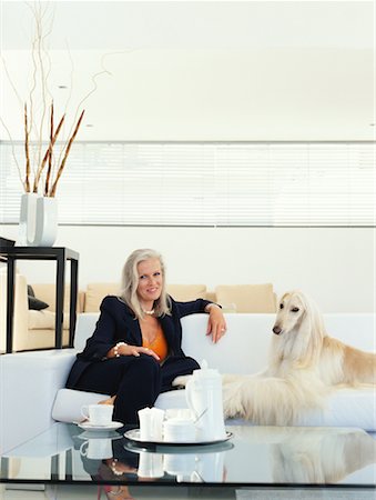 simsearch:700-00897631,k - Woman Sitting on Sofa With Dog Stock Photo - Rights-Managed, Code: 700-00557027