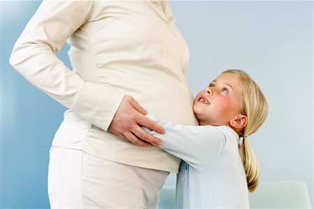 simsearch:700-00557270,k - Daughter Hugging Pregnant Mother Stock Photo - Rights-Managed, Code: 700-00557270