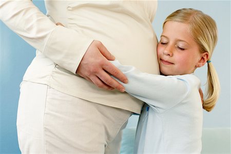 simsearch:700-00557270,k - Daughter Hugging Pregnant Mother Stock Photo - Rights-Managed, Code: 700-00557271