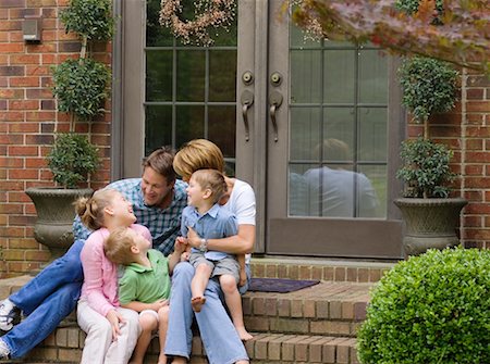 simsearch:700-00514116,k - Family Sitting Outdoors Stock Photo - Rights-Managed, Code: 700-00557518