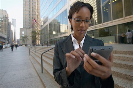 Businesswoman Using Electronic Organizer, Toronto, Ontario, Canada Stock Photo - Rights-Managed, Code: 700-00550048