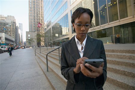 Businesswoman Using Electronic Organizer, Toronto, Ontario, Canada Stock Photo - Rights-Managed, Code: 700-00550049