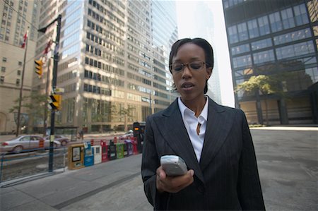 Businesswoman With Cellular Phone, Toronto, Ontario, Canada Foto de stock - Con derechos protegidos, Código: 700-00550053