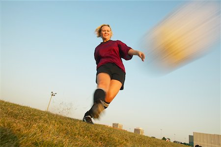 simsearch:700-00478703,k - Girl Kicking Soccer Ball Stock Photo - Rights-Managed, Code: 700-00550137
