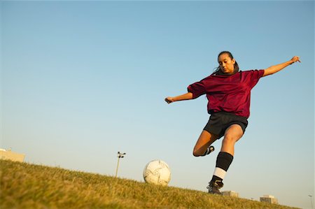 simsearch:700-00478703,k - Girl Kicking Soccer Ball Stock Photo - Rights-Managed, Code: 700-00550140