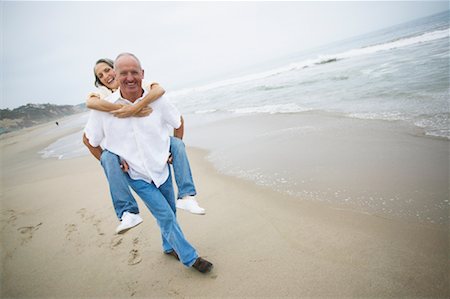 simsearch:700-00190697,k - Man Giving Woman Piggy Back Ride Stock Photo - Rights-Managed, Code: 700-00550327