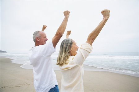 simsearch:700-00190697,k - Couple Cheering on Beach Stock Photo - Rights-Managed, Code: 700-00550356