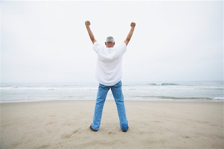 simsearch:700-00190697,k - Man Cheering on the Beach Stock Photo - Rights-Managed, Code: 700-00550358