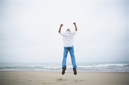 simsearch:700-00190697,k - Man Jumping on Beach Stock Photo - Rights-Managed, Code: 700-00550359