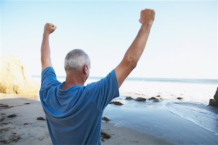 simsearch:700-00190697,k - Man Cheering on Beach Stock Photo - Rights-Managed, Code: 700-00550365