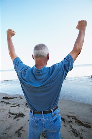 simsearch:700-00190697,k - Man Cheering on Beach Stock Photo - Rights-Managed, Code: 700-00550366