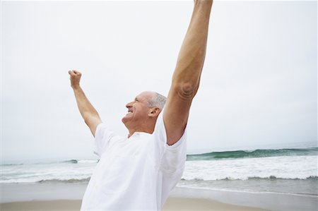 simsearch:700-00190697,k - Man Cheering on Beach Stock Photo - Rights-Managed, Code: 700-00550361