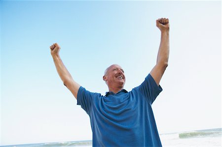 simsearch:700-00439935,k - Man Cheering at Beach Stock Photo - Rights-Managed, Code: 700-00550362