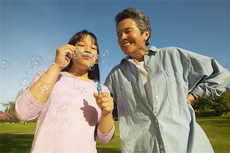 simsearch:700-00046927,k - Grandmother and Granddaughter Blowing Bubbles Stock Photo - Rights-Managed, Code: 700-00550607